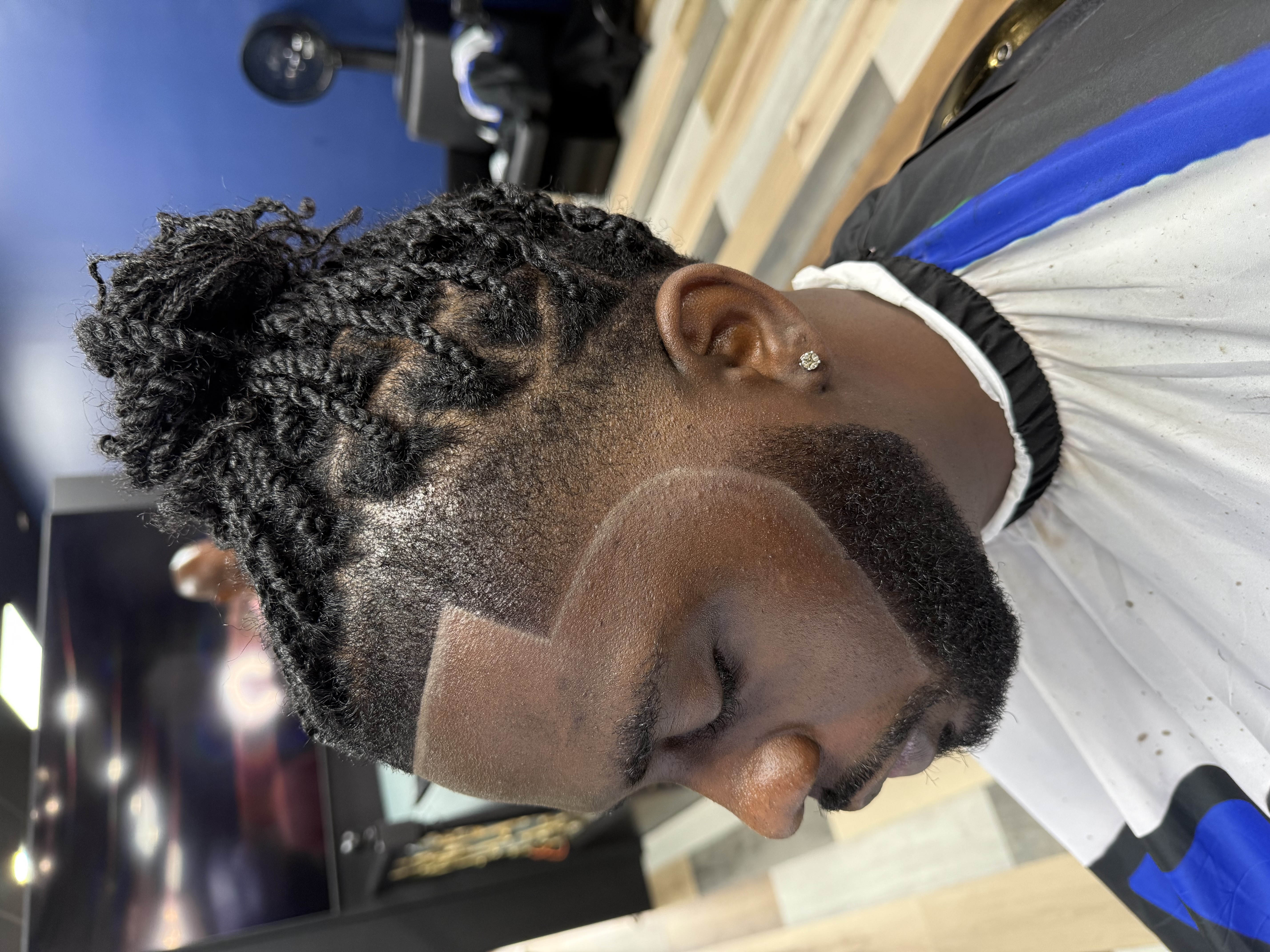 Barber shaping a beard at Mr. Kelly's Barber Shop